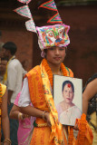Boy Dressed as Cow with Photo of Dead Relative Gai Jatra