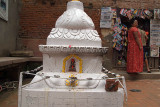 Whitewashed Stupa with Shop Behind Patan