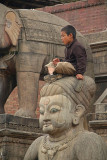 Boy Sitting on Stone Wrestler Bhaktapur