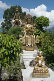 Statues in front of 1000 Buddha Stupa Detail Kopan Monastery