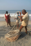 Fishermen Pulling in Nets Black Beach