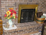 Our hearth: a Greek Horse  from Craigslist, a thrift shop vase, and an Elephant carving that is a gift from India.