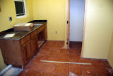 The laundry room is tiled and ready to be grouted