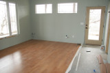 Darlene and Carol got most of the flooring down in the master bedroom