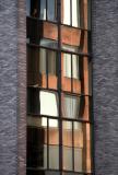 NYU Tisch Building Reflected in the Courant Institute of Mathematics Windows