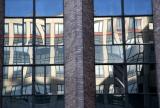 NYU Business School Reflected in Mathematics Building Windows