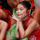 Red and green chilli pepper dance of a chinese children dance group