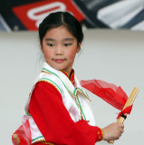 Chinese girl performing a mongolian dance called the happy chop sticks
