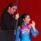 backstage scene...female chinese acrobat and her stage supporter
