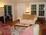 Living room with new coffee table and pink chairs