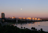 Sun setting as gibbous moon rises over Perth Water