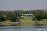 A VIEW OF HL HUNTS HOUSE, MOUNT VERNON, FROM ACROSS THE LAKE