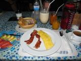 breakfast Sunday morning @ Tuptims, Banana Milkshake 45B,2 egg omlet, bacon, OJ, toast butter jam and tea for 120b