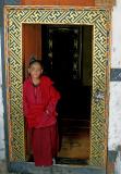 boy monk in doorway-Bhutan