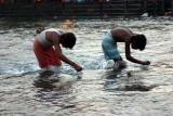 Searching for coins in the river, Haridwar