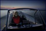 Madelene driving our boat in 30 knots on lake Helgasjön