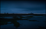 Bad weather at dusk near lighthouse Långe jan