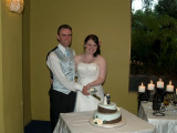 Brett and Tanya cutting the cake