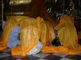 People Praying at the feet of the Buddha at Wat Phananchoeng