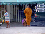Monk Collecting his Morning Alms in Putham Thani