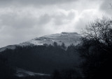 Herefordshire Beacon showing its former life as an Iron Age British Camp in snow