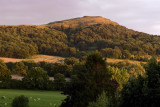 British Camp or Herefordshire Beacon - from our window as the evening sunlight catches it and clouds move in from the east