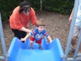 Aunt Rosie helps Jack the wrong way up the slide