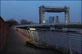 Tidal barrier, Millennium Bridge and walkway at dusk