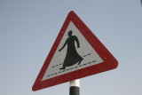 Caution man in Dish Dasha crossing.JPG