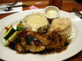 GLAZED CHICKEN ON APPLE STUFFING, MASHED POTATOES, ROASTED VEGGIES AND BISQUITS.