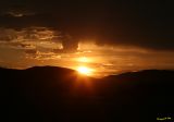 Clouds Sun and mountains