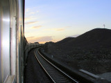 Train climbing grade at sunset