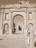 Sbeitla - sepia shot of dramatic entrance arch to temples & Forum