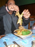 At Judiths birthday celebration in a Tozeur restaurant, Ben displays camel meat in his traditional couscous dish