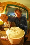 Hiker Diggijng In To Half Gallon Ice Cream At Dinmores Hiker Hostel