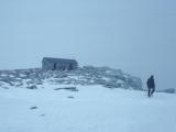 Hiker closes in on Mt. Whitney Summit and Rock Shelter