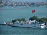  Ferry and large Turkish flag from Galata Tower . The Bosphorus beyond the Golden Horn