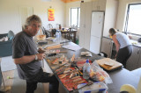 Ian making a mess carving wood in Karen's kitchen