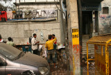 32-Low-overhead sidewalk barbers