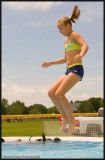 Pool jumping girl with ponytail