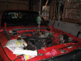 Supporting the motor so I could drop the front cross member & the oil pan to drill the return hole in the block