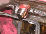 Tapping the return line hole