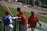 Players milling around the cage