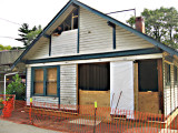 Nailing in the siding on the west end