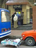 The strange combination of busy ATM and unattended street stand.