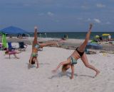 Hand stands in the sand. Ft - Bk daughter Amy,friend Kira and grand daughter Taylor. June '06