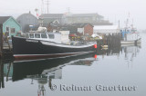 Tour boat in fog at Fishermans Cove Eastern Passage Halifax Nova Scotia