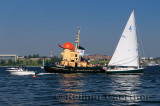 Tourist tugboat sailboat and motorboats in Halifax harbour Dartmouth Nova Scotia