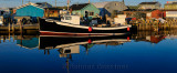 Sunrise with tour boat at Fishermans Cove Eastern Passage Halifax Nova Scotia