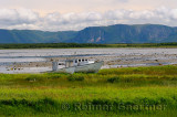 Abandoned boats at Parsons Pond Newfoundland with Gros Morne Long Range Mountains